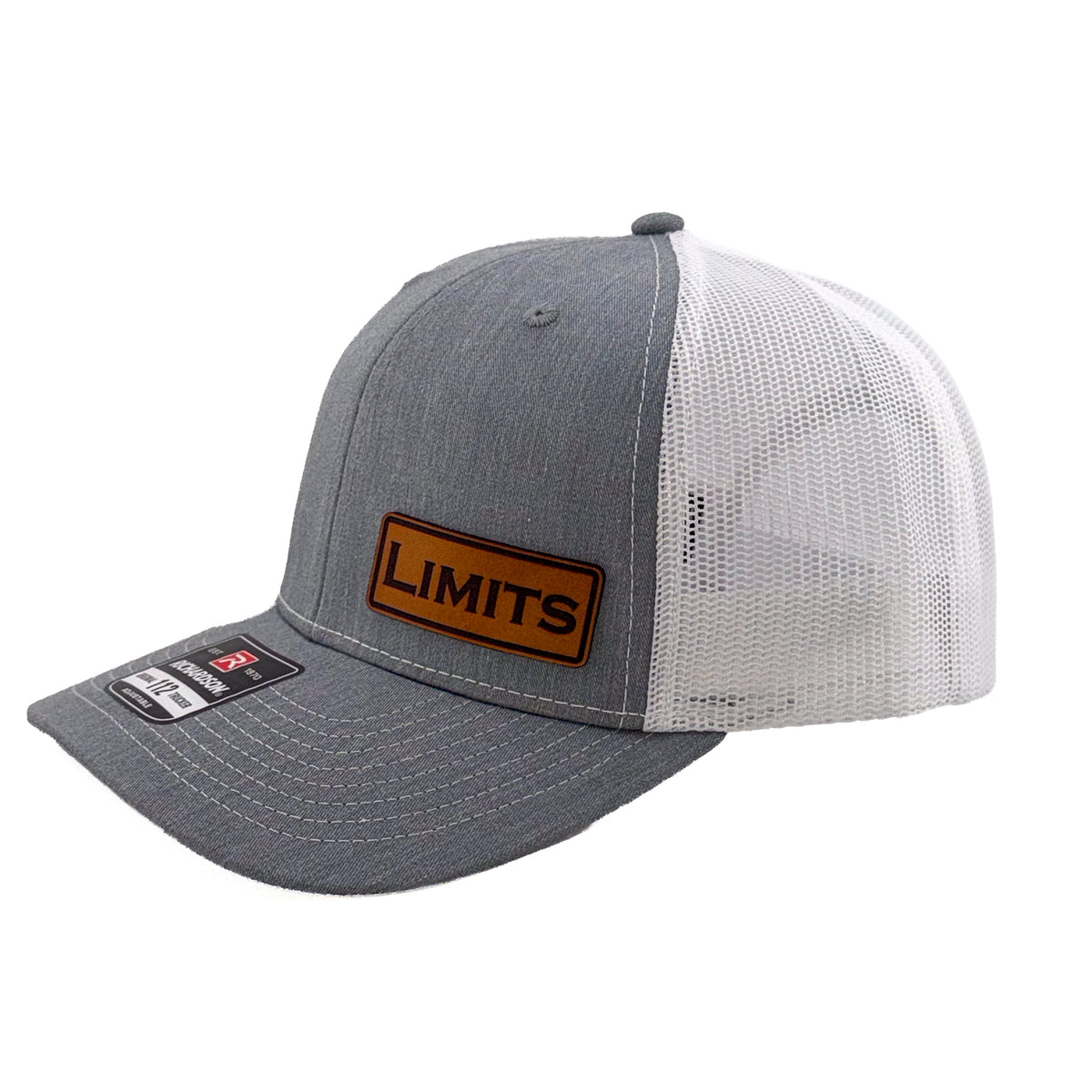 A Richardson 112 trucker hat in heather grey and white mesh, featuring a brown leather patch on the front with the word 'LIMITS' and a Richardson brand sticker on the visor.