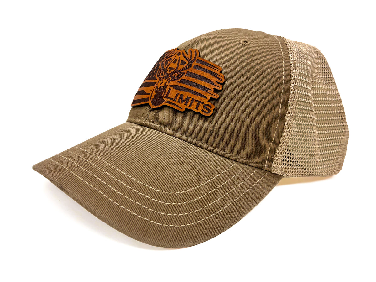 A trucker-style baseball cap in olive brown with a tan mesh back and a brown embroidered patch on the front featuring a deer head and the text 'DEERHEAD LIMITS'.