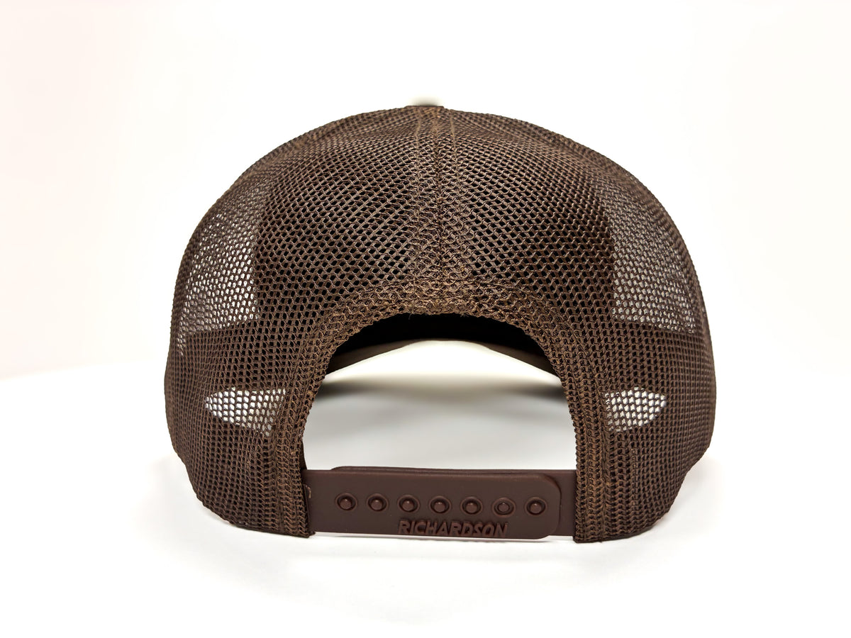 A brown trucker-style cap viewed from the back, featuring a brown mesh back and a matching brown plastic snap closure.