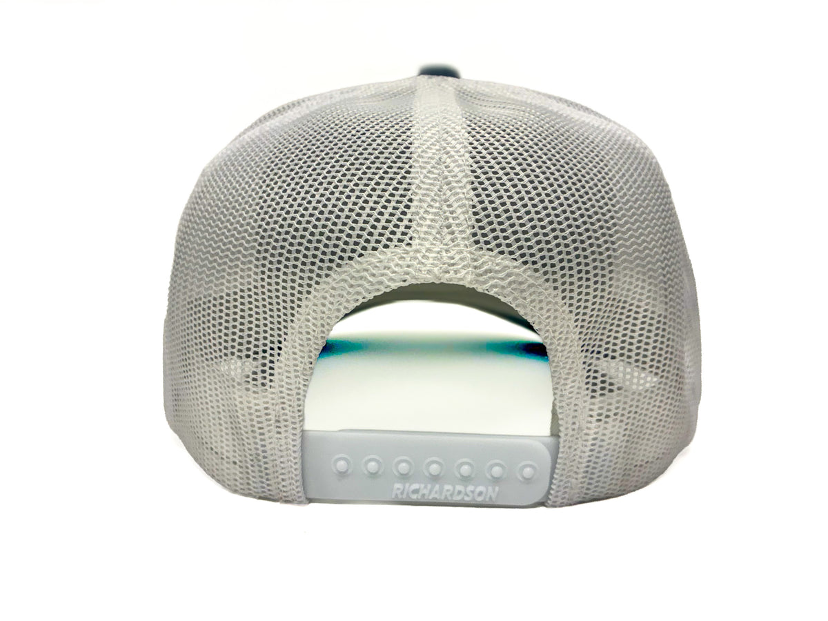 The back view of a White mesh trucker cap with a plastic white snapback closure and 'Richardson' printed on the closure.