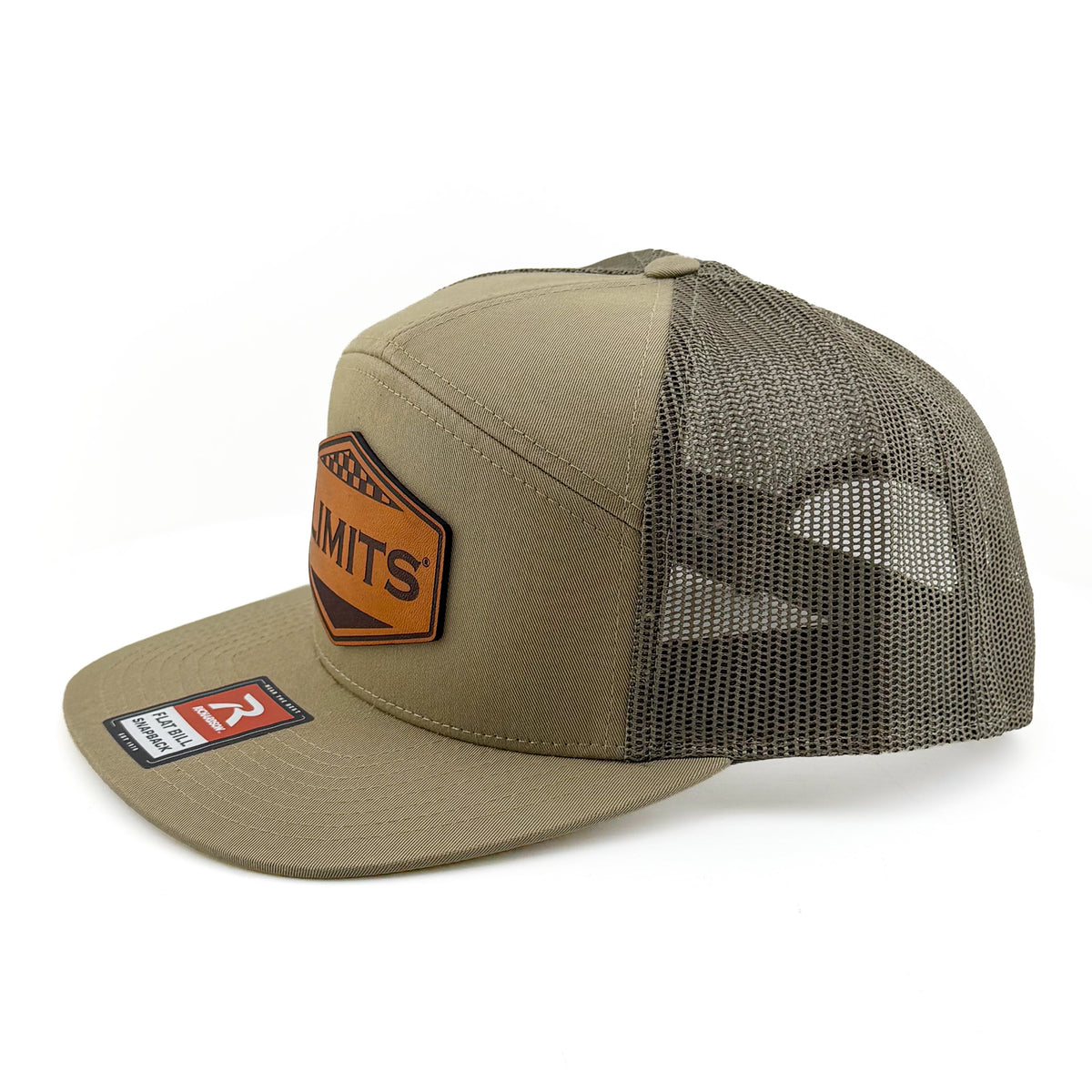 A trucker-style baseball cap in khaki and dark gray mesh, featuring a brown leather patch on the front with the brand name 'SUBMITS' and a red and white size tag on the brim.
